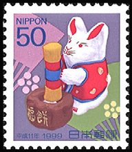 Colnect-2397-022-Rabbit-Pounding-Steamed-Rice-into-Cake-Mochi-tsukiusagi.jpg